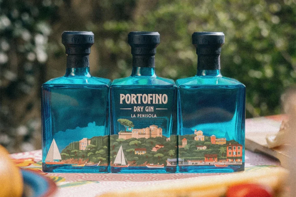 Three bottles of Portofino La Penisola gin placed side-by-side, forming a panorama.